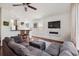 Spacious living room with hardwood floors and a comfortable gray sofa set at 120 Diploma Dr, Ladson, SC 29456