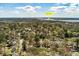 Gorgeous aerial view of the property showing the home nestled amongst lush trees, near the Stono River at 1235 Sunset Dr, Charleston, SC 29407