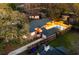 Aerial view of a cozy home with a pool and wooden deck in a leafy neighborhood at 1235 Sunset Dr, Charleston, SC 29407