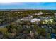 Aerial view of the property in a tree filled neighborhood near local shopping at 1235 Sunset Dr, Charleston, SC 29407