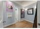 Charming entryway with light blue walls and hardwood flooring leads into the home at 1235 Sunset Dr, Charleston, SC 29407