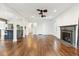 Open-concept living room with hardwood floors, fireplace, and access to the kitchen at 1245 Forestwood Dr, Charleston, SC 29407