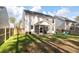 Backyard view featuring a screened porch, a fenced yard, and an arrangement of blue chairs at 133 Caleb Ct, Ladson, SC 29456