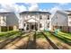 Backyard with a screened porch, a fenced yard, blue chairs, and a fire pit, perfect for outdoor relaxation at 133 Caleb Ct, Ladson, SC 29456