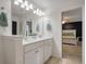 Clean bathroom features double sinks, framed mirror and view into main bedroom at 133 Caleb Ct, Ladson, SC 29456