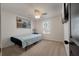 Cozy bedroom with a bed, a window providing natural light, and a picture of the Brooklyn Bridge at 133 Caleb Ct, Ladson, SC 29456