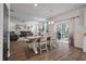 Dining area next to an outdoor patio with hardwood floors and an open concept layout at 133 Caleb Ct, Ladson, SC 29456