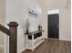 Inviting entryway featuring hardwood floors, a console table, and a 'welcome' sign at 133 Caleb Ct, Ladson, SC 29456