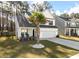 Inviting two-story home featuring a palm tree, covered porch, and a well-maintained front lawn at 133 Caleb Ct, Ladson, SC 29456