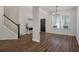 Open concept foyer with hardwood floors, stairs to second level, and lots of natural light at 133 Caleb Ct, Ladson, SC 29456
