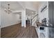Inviting foyer features hardwood floors, modern chandelier, and staircase to the upper level at 133 Caleb Ct, Ladson, SC 29456