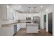 Modern kitchen with white cabinetry, stainless steel appliances, and granite countertops at 133 Caleb Ct, Ladson, SC 29456