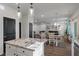 View from the kitchen island with a sink towards the dining area and the Gathering room at 133 Caleb Ct, Ladson, SC 29456