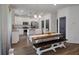 Kitchen and dining area with stainless steel appliances, granite counters, and a dark accent door at 133 Caleb Ct, Ladson, SC 29456