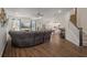 Open-concept living room and staircase with hardwood flooring and neutral decor at 133 Caleb Ct, Ladson, SC 29456