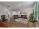 Spacious living room features a comfortable sectional sofa and stylish decor at 133 Caleb Ct, Ladson, SC 29456