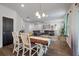 Open concept living area with hardwood floors and a large comfortable sectional sofa at 133 Caleb Ct, Ladson, SC 29456