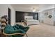 Spacious main bedroom featuring an accent wall, ceiling fan, and a comfortable king-size bed at 133 Caleb Ct, Ladson, SC 29456