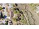 Aerial view showcasing the property's location near a winding river and lush greenery at 1522 N Pinebark Ln, Charleston, SC 29407