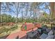 Relaxing back deck with a convenient outdoor kitchen and lush backyard at 1522 N Pinebark Ln, Charleston, SC 29407