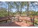 Back deck featuring built-in seating overlooking the peaceful and private backyard at 1522 N Pinebark Ln, Charleston, SC 29407
