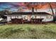 Large backyard with a wooden deck and a well-maintained lawn, perfect for entertaining at 1522 N Pinebark Ln, Charleston, SC 29407