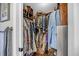 Walk-in closet with wooden shelves and rods for ample storage and organization of clothes and shoes at 1522 N Pinebark Ln, Charleston, SC 29407