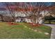 Charming brick home featuring landscaped yard with mature trees and stone pathway at 1522 N Pinebark Ln, Charleston, SC 29407
