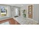 Bright foyer with decorative tile flooring, textured front door and natural light at 1522 N Pinebark Ln, Charleston, SC 29407