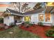 Charming brick home featuring landscaped yard, stone pathway, and covered porch at 1522 N Pinebark Ln, Charleston, SC 29407