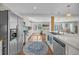 Bright, open kitchen offers stainless steel appliances, blue backsplash, butcher block countertops, and an island with seating at 1522 N Pinebark Ln, Charleston, SC 29407