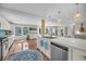 Open concept living area with fireplace, kitchen island and an abundance of natural light at 1522 N Pinebark Ln, Charleston, SC 29407