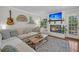 Comfortable living room with a fireplace, a large sofa, and a guitar adorning the wall at 1522 N Pinebark Ln, Charleston, SC 29407