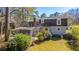 Backyard of home featuring established foliage and greenery and screened porch at 202 Hunt Club Dr, Summerville, SC 29485