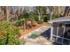 Backyard showing outdoor furniture, swing set, screened porch, and lush landscaping at 202 Hunt Club Dr, Summerville, SC 29485