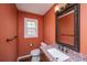 Stylish half bathroom with granite countertops and updated fixtures at 202 Hunt Club Dr, Summerville, SC 29485