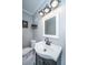 Modern bathroom with a sleek vanity, square mirror, and contemporary lighting fixtures at 202 Hunt Club Dr, Summerville, SC 29485