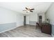 Well-lit bedroom featuring closet and desk, and wood-look flooring at 202 Hunt Club Dr, Summerville, SC 29485