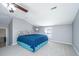 Bright bedroom with ceiling fan, neutral walls, carpet, and a comfortable queen-size bed at 202 Hunt Club Dr, Summerville, SC 29485