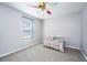 Bright, cozy bedroom with neutral walls, plush carpet, and a small bed at 202 Hunt Club Dr, Summerville, SC 29485