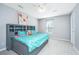Cozy bedroom with a unique headboard, plush bedding, and bright window at 202 Hunt Club Dr, Summerville, SC 29485