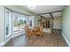 Cozy dining area with a bay window, wood table, chairs, and easy access to living area at 202 Hunt Club Dr, Summerville, SC 29485
