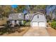 Inviting two-story home with a gray exterior, dormer windows, and an attached two-car garage at 202 Hunt Club Dr, Summerville, SC 29485