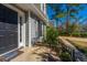 Close-up of the entrance showing the front door, landscaping, and walkway to the charming home at 202 Hunt Club Dr, Summerville, SC 29485