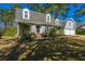 Attractive two-story home with dormer windows, a manicured lawn, and a welcoming front entrance at 202 Hunt Club Dr, Summerville, SC 29485