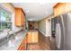 Well-lit kitchen featuring stainless steel appliances, granite countertops and ample cabinet space at 202 Hunt Club Dr, Summerville, SC 29485