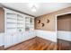 Bright living room with custom built-in bookshelves and wood flooring at 202 Hunt Club Dr, Summerville, SC 29485