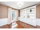 Cozy living room with custom built-in bookshelves and a large window at 202 Hunt Club Dr, Summerville, SC 29485
