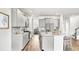 Open kitchen with stainless appliances, large island, and modern gray cabinets at 204 Belfort Pl, Summerville, SC 29486