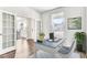 Bright home office with desk, chair, and view through the French doors at 204 Belfort Pl, Summerville, SC 29486